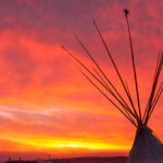 sunrise tipi with a red glow at Standing Rock Encampment Oceti Sakowin