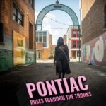 movie poster for the documentary film Pontiac - Roses Through The Thorns with Shaniqua Staples walking through a gritty alley with street art in Pontiac, Michigan